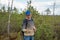 A man holds in his hand sphagnum moss