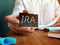 Man holds Individual Retirement Account IRA sign on the sheet