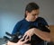 A man holds a Labrador retriever puppy