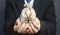 A man holds out a yen yuan money bag. Trade, economics. Granting financing business project or education. Provision cash financial