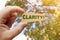 A man holds a sign inside which the inscription - Clarity