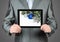 Man holds tablet PC with Christmas composition