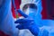 Man holds test tube with danger symbol in his hands