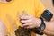 Man holds three Spotted Toadhead Agama lizards