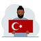 A man holds a Turkish flag in his hands. Concept for demonstration, national holiday, Turkey day or patriotism
