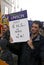 Man holds up a UNISON placard saying