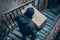 Man with hoodie stealing a package at the doorstep - AI Generated