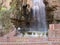 A man in the hot springs and natural pool at Hammamat Ma`In Hot Springs, Jordan