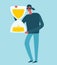 Man with hourglass. Modern colorful vector illustration..