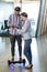 Man on hoverboard using digital tablet with colleagues