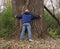 Man Hugging a Massive Cottonwood Tree, Tree Hugger