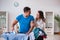 The man husband ironing at home helping his wife