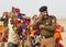 Man in indian military uniform calling by mobile phone