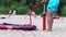 A man inflates a rubber boat for children with a pump ,Marupe,Latvia - 07 July 2021