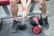 Man injury Wrist pain after workout with dumbbell in gym
