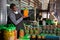 Man inspecting glass jar with pickled olives