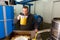 Man inspecting pressing of olive oil