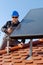 Man installing alternative energy photovoltaic sol