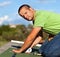 Man installing bitumen roof shingles