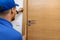 Man installing door architrave