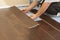 Man Installing New Laminate Wood Flooring