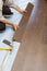 Man Installing New Laminate Wood Flooring