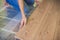 Man installing new wooden laminate flooring. infrared floor heat