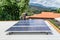 man installing solar panels on a roof house for alternative energy photovoltaic safe energy. power from nature sun power solar