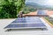 man installing solar panels on a roof house for alternative energy photovoltaic safe energy. power from nature sun power solar