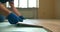 A man installs a laminate board with lock on a polystyrene substrate