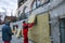 A man installs a layer of thermal insulation in the form of mineral wool panels.