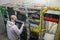 A man installs new equipment in the computer rack of the server room. The system administrator updates the hardware of the