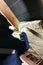 A man installs a thermal insulation layer of a thermal roof - using panels of mineral wool, mounting it between the beams of the