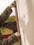 The man insulates the house with foam blocks