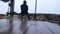 Man isolated sitting on swing at evening from low angle