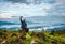 Man isolated taking selfie at hill top with amazing cloud layers in background