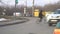A man in a jacket and hat on a Bicycle crosses the road at a green traffic light. Pedestrian crossing
