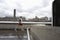 Man jogging along the Thames with the Tate Modern in the background