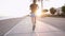 Man jogging on a beach.