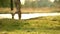 A man jogs early in the morning after the sun began to dry residual water after the rain