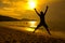 Man jumping on beach sunset