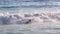 Man jumping in big waves on beach in Leblon