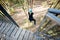 Man jumping from a bungee tower