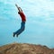 Man jumping cliff
