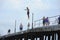 Man jumping down from the pier, people watching