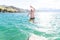 Man jumping in a lake on summer vacation