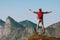 Man jumping on mountain cliff travel active healthy lifestyle outdoor