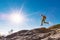 Man jumping over gap on mountain hike