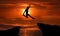 Man jumping over precipice between two rocky mountains