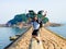 A man jumping on Qingdao trestle bridge